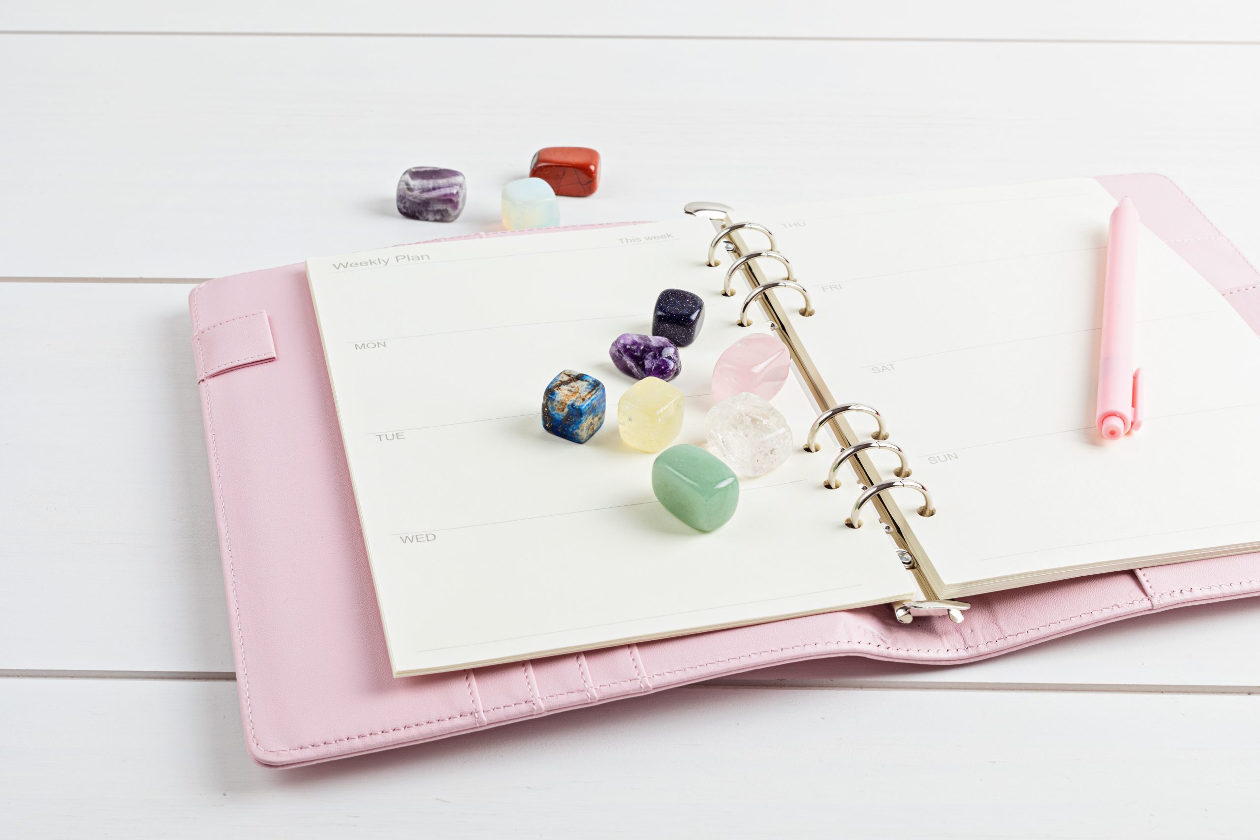 Healing reiki chakra crystals and open organizer. Gemstones for