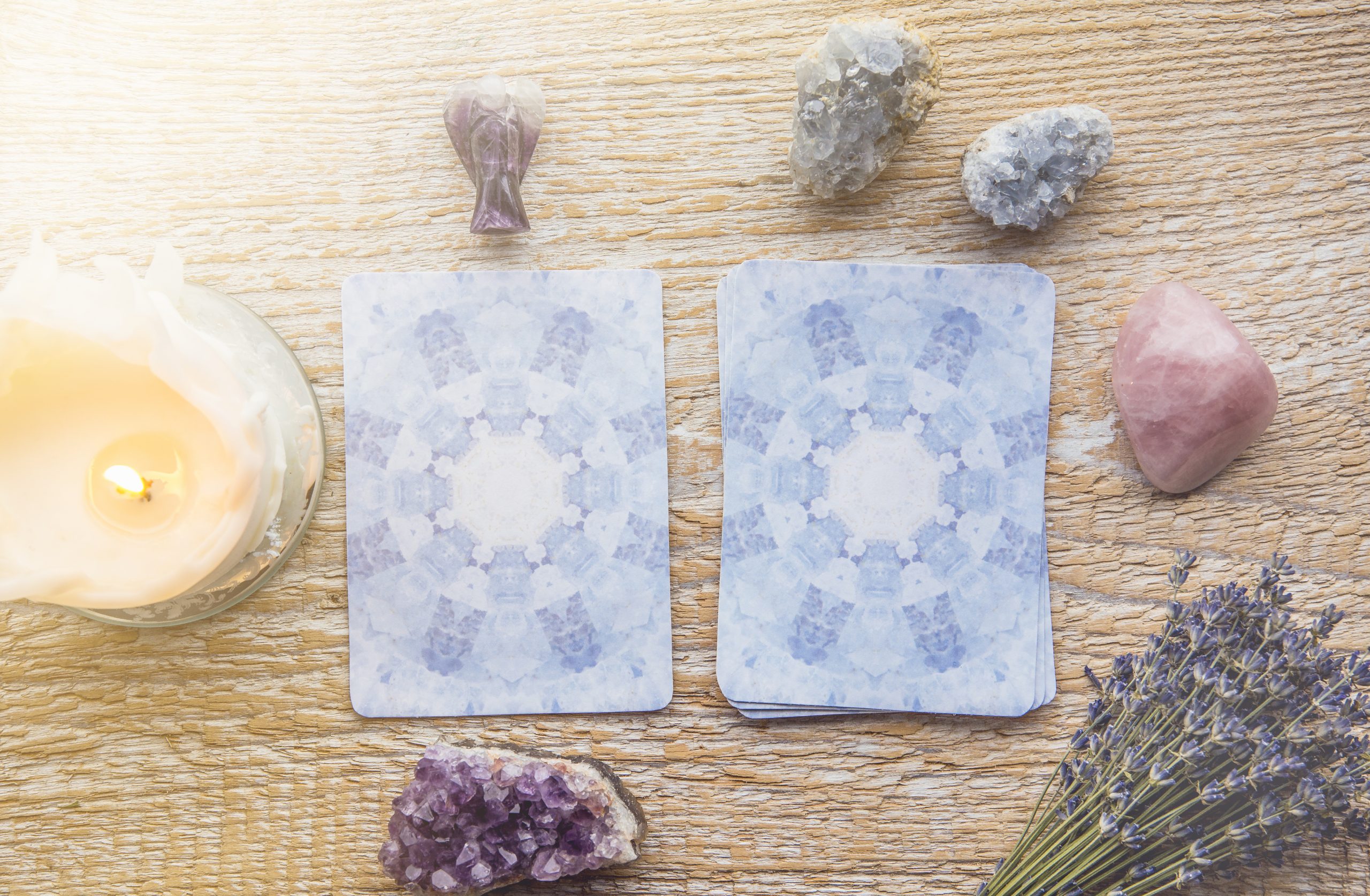 Deck with divination Angel cards on light wooden table, surround